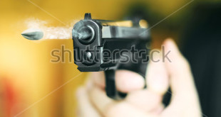 stock-photo-hand-gun-automatic-pistole-with-flying-bullet-fire-532657279